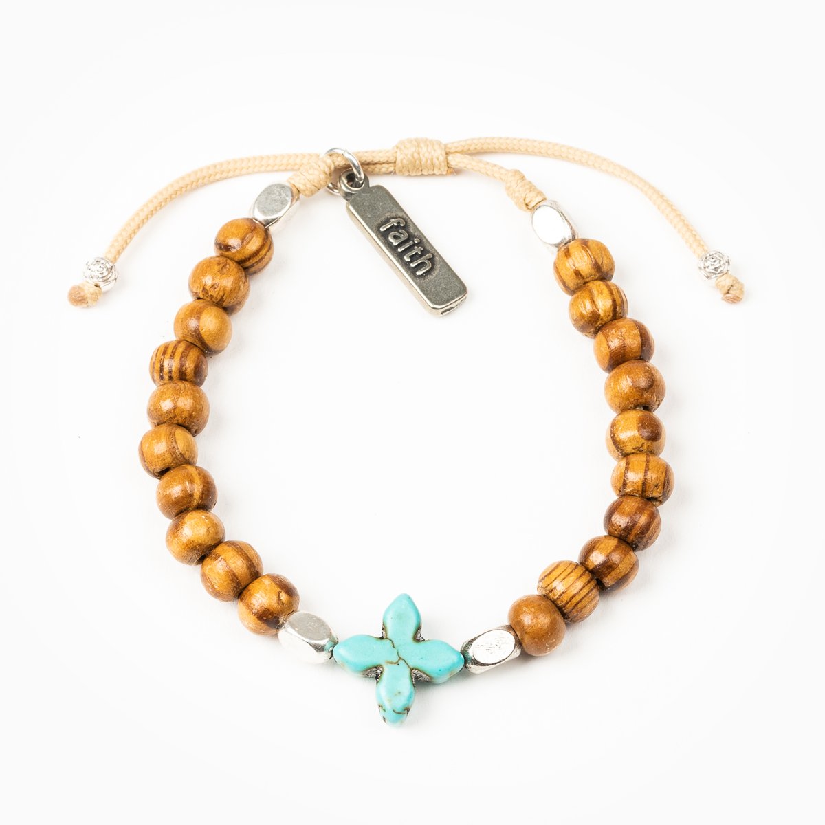 Grounded in Faith Olive Bead Bracelet with blue dyed cross, silver tone faith charm tag, on tan bracelet cording